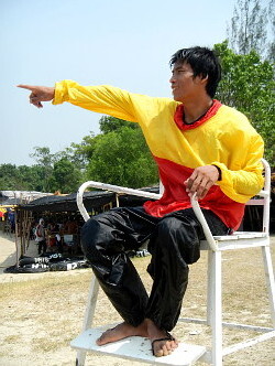 lifeguard in cagoule anorak on chair tower